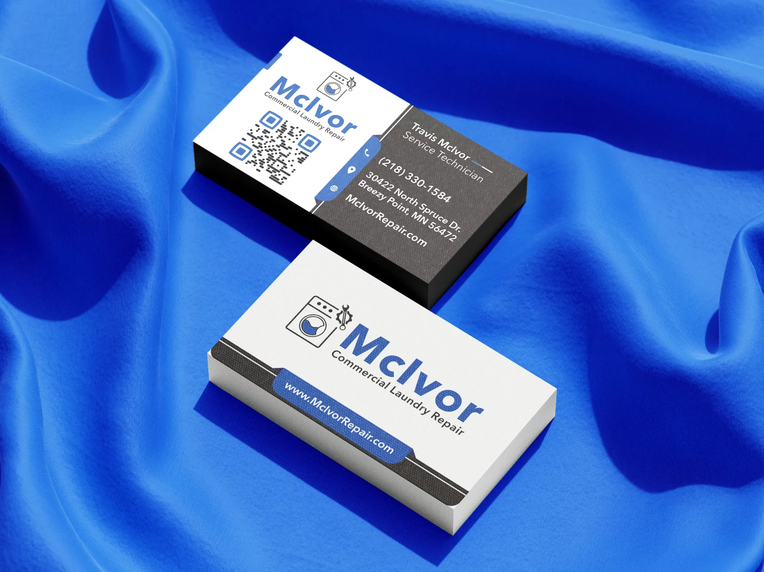 Professional business card mockup for McIvor Commercial Laundry Repair featuring Service Technician Travis McIvor. The front of the card uses a high-contrast white background with a large QR code for quick digital access and the company’s blue and black brand identity. The reverse side features a modern dark-themed layout with white contact details, a Breezy Point, MN address, 218 area code phone number, and a direct link to McIvorRepair.com.